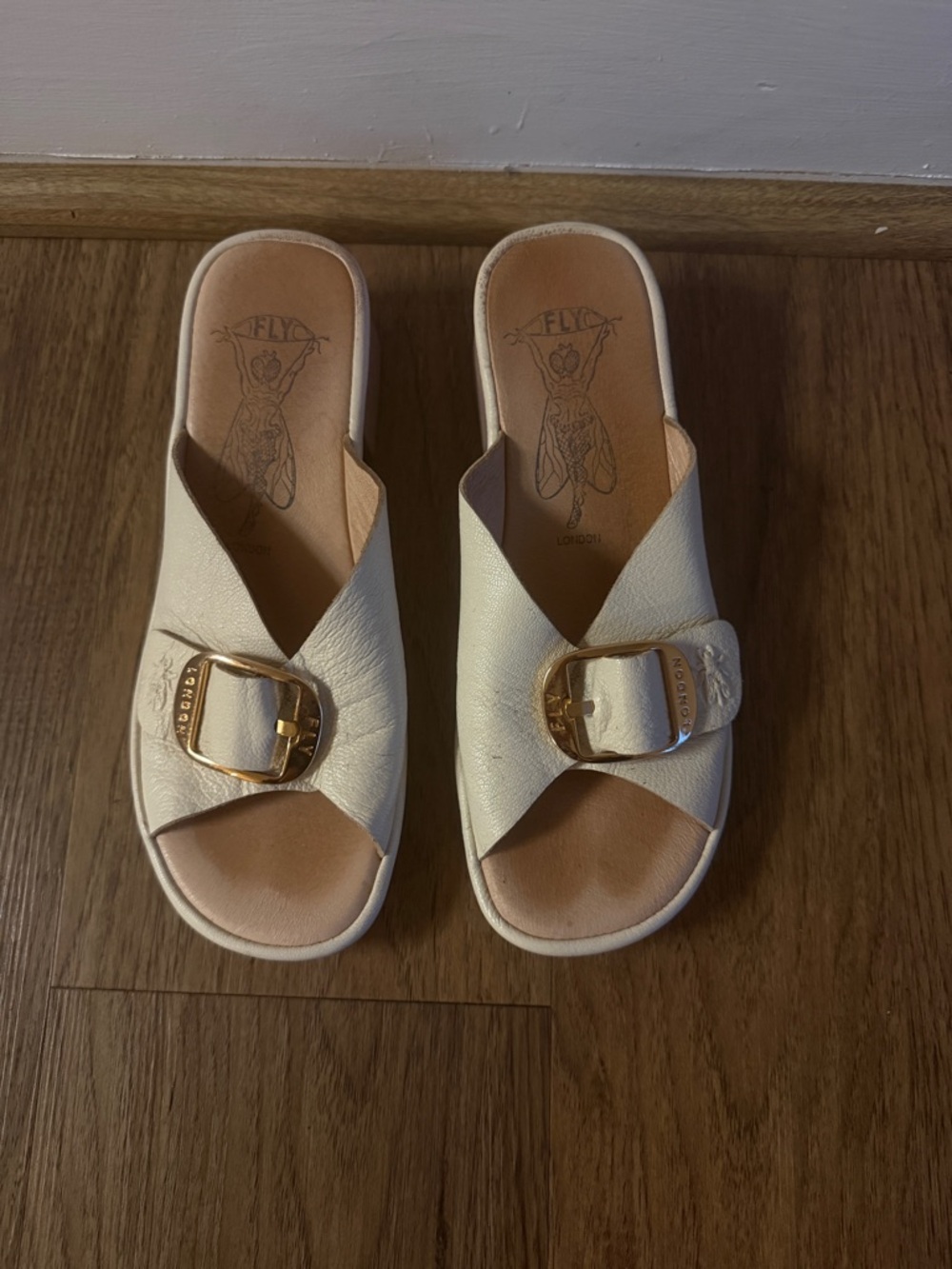 Fly London Cream Slide Mules with Gold Buckles
